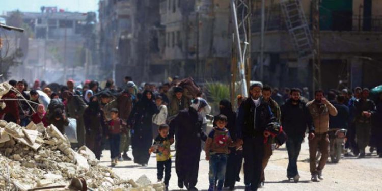 العودة الصعبة لأهل الغوطة والتخوف من القانون 10