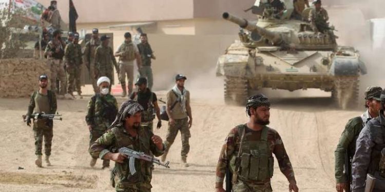 البوكمال: مليشيات إيران تُنزِلُ علم النظام